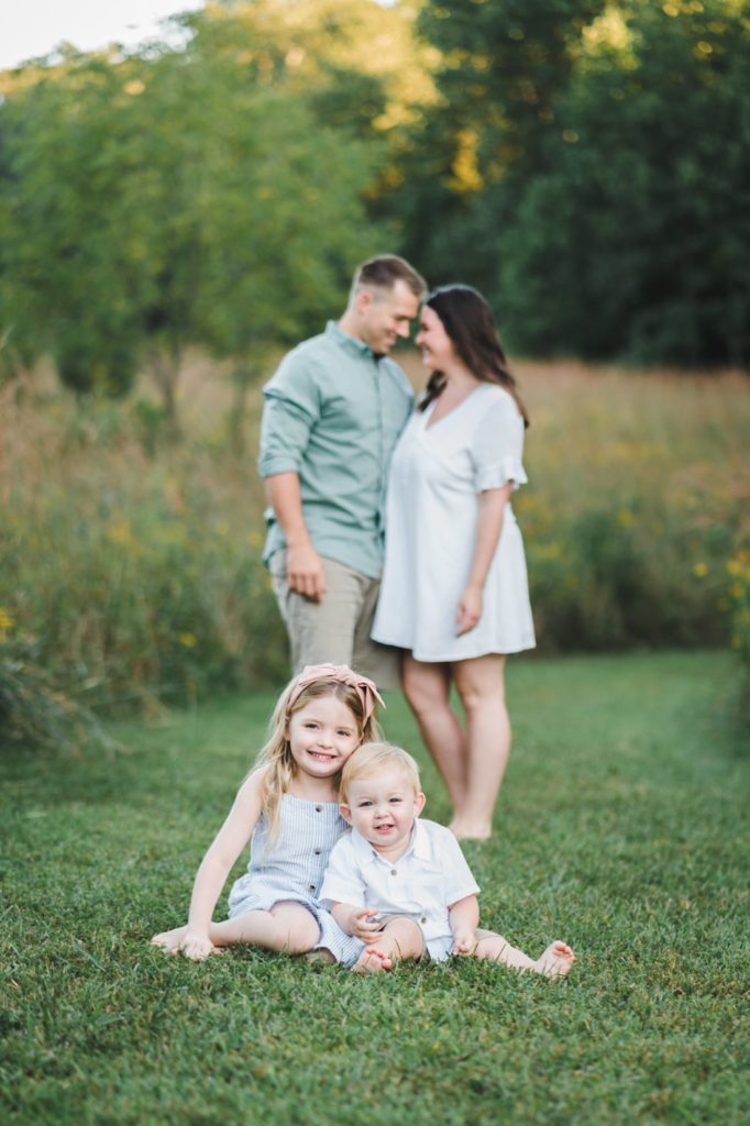 family of four in green grass | dayton family photographer