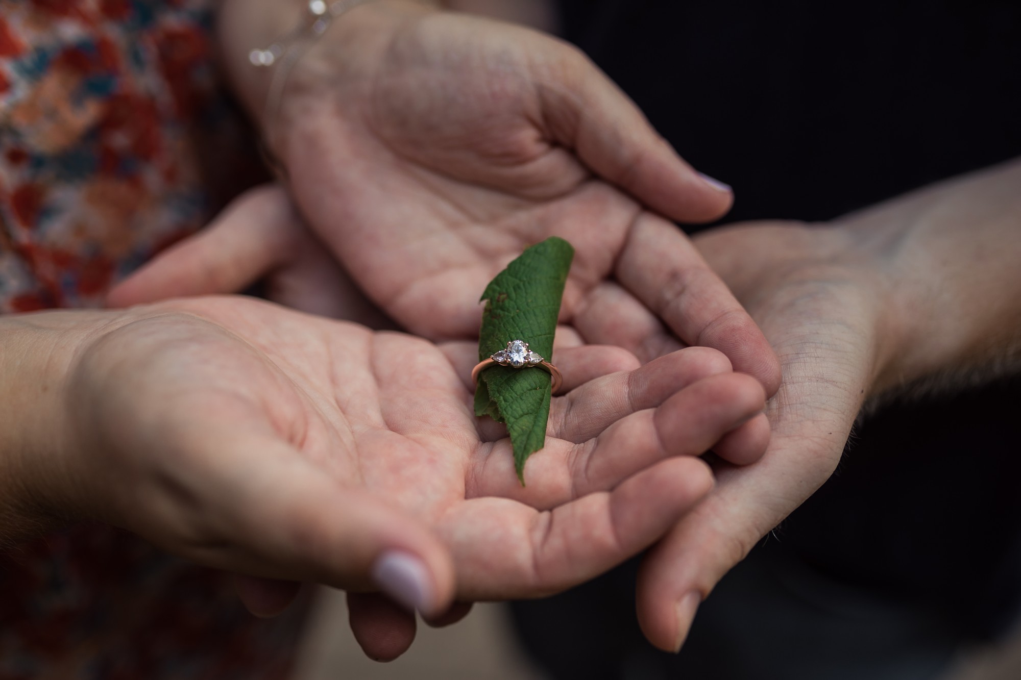 ring with leaf in it being held in hands | Fredericksburg VA Engagement Session