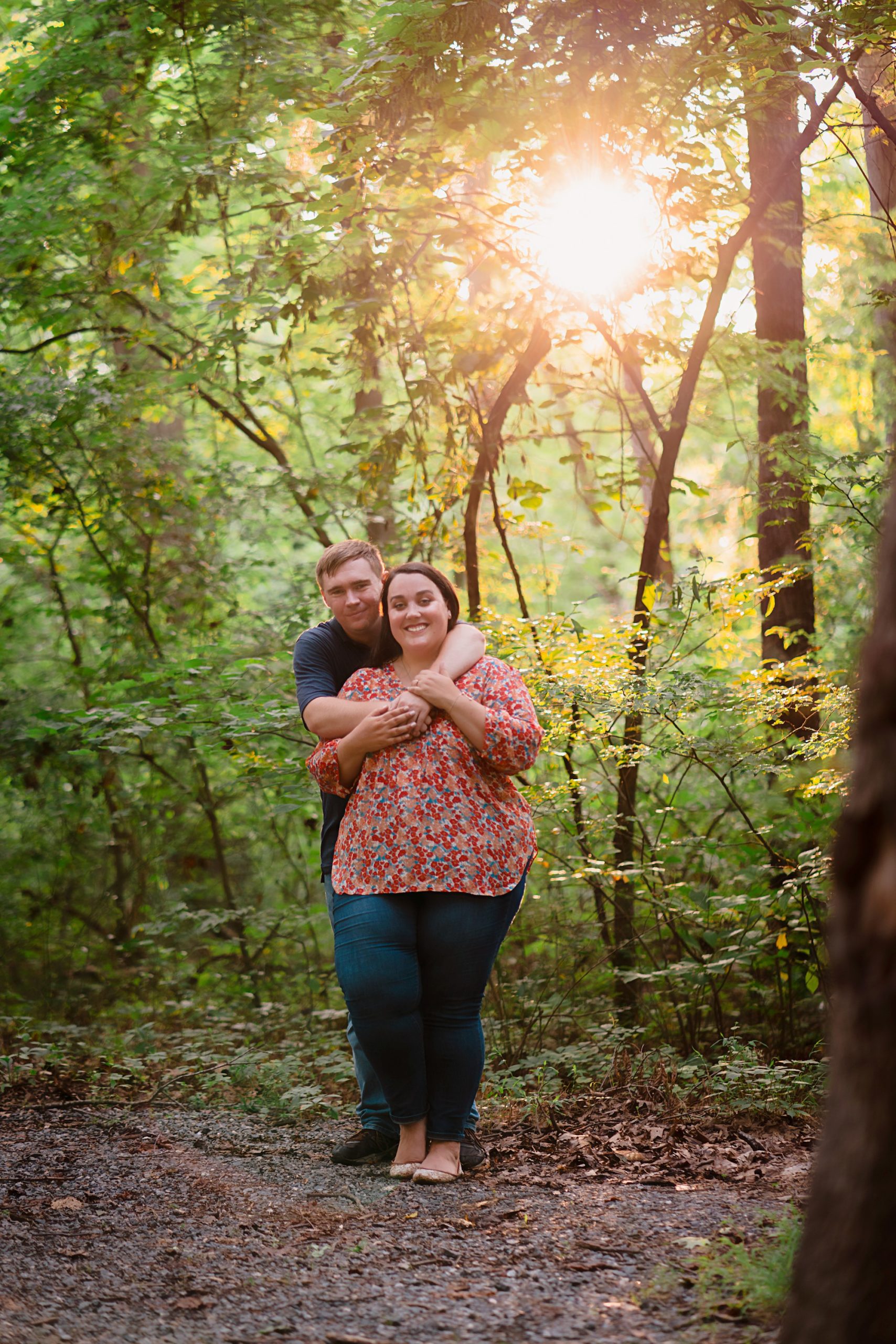 couple holding each other in sunlight | Fredericksburg VA Engagement Session