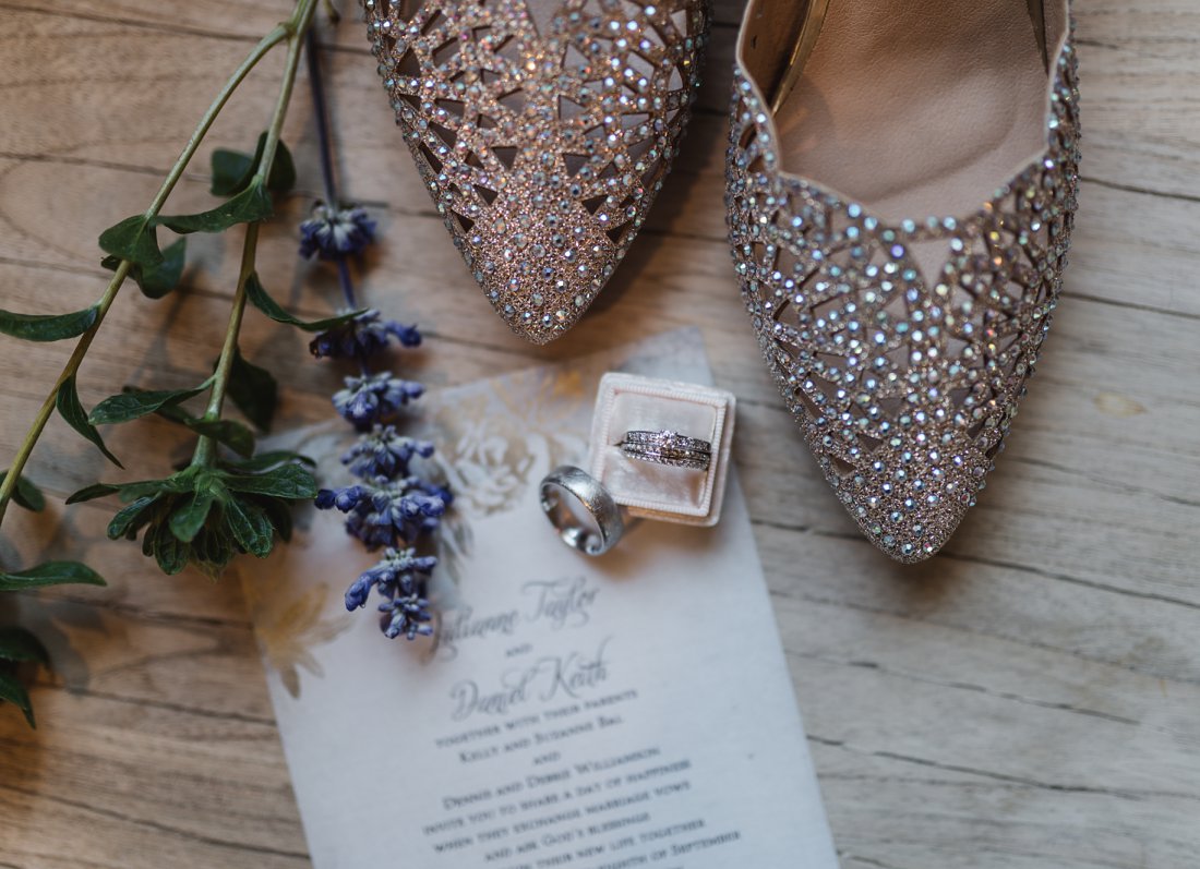 flat lay of wedding details with flowers