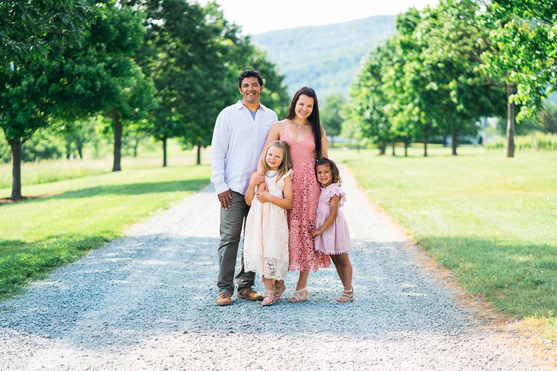 Family standing on gravel road | photo session locations in charlottesville