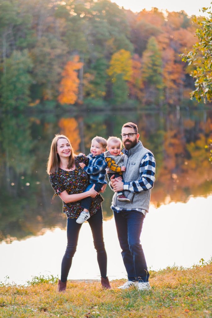 Family standing in front of pond | photo session locations in Charlottesville
