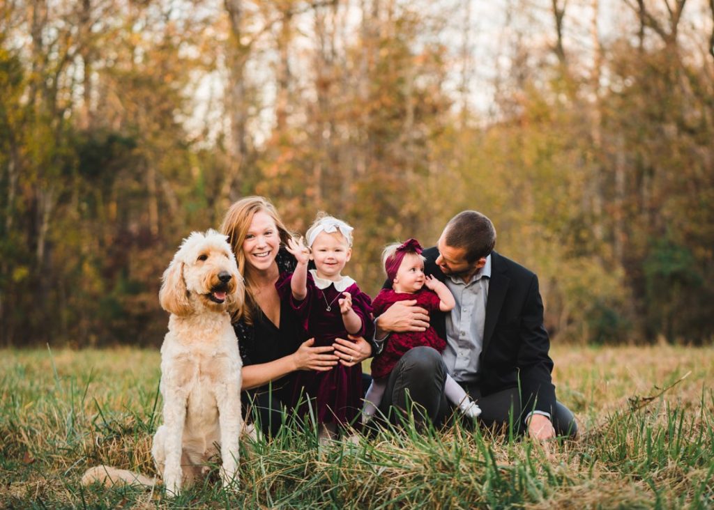 Family of four in field with their dog | Family Photographer