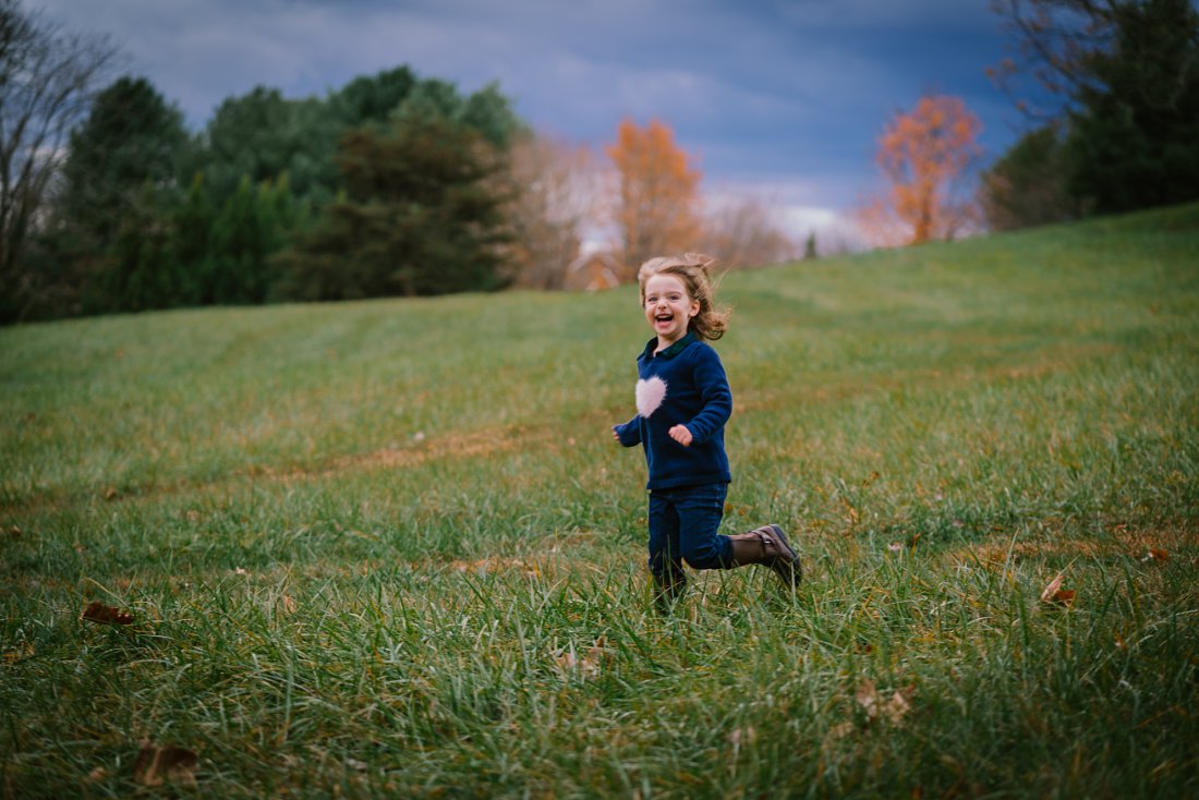 Girl running through the grass