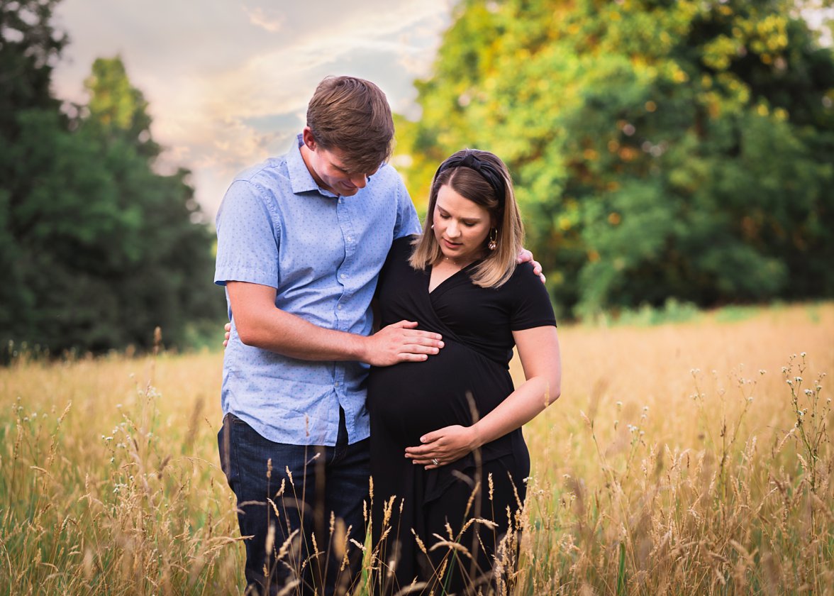 Dad with pregnant mom in field | Charlottesville VA Maternity Photographer