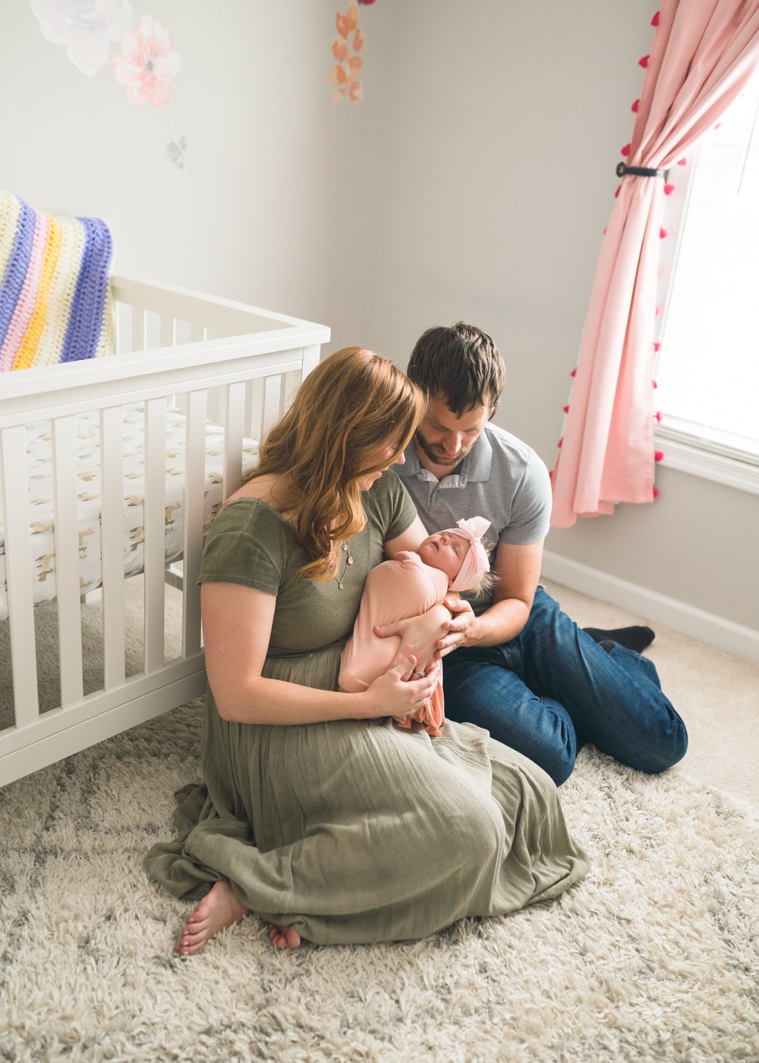 mom and dad holding new baby girl | Montgomery Alabama newborn lifestyle photographer
