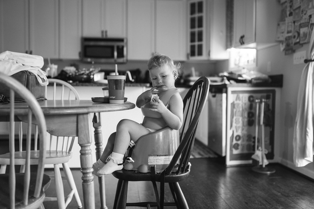 toddler sitting in high chair in kitchen | Dayton Ohio Newborn Photographer