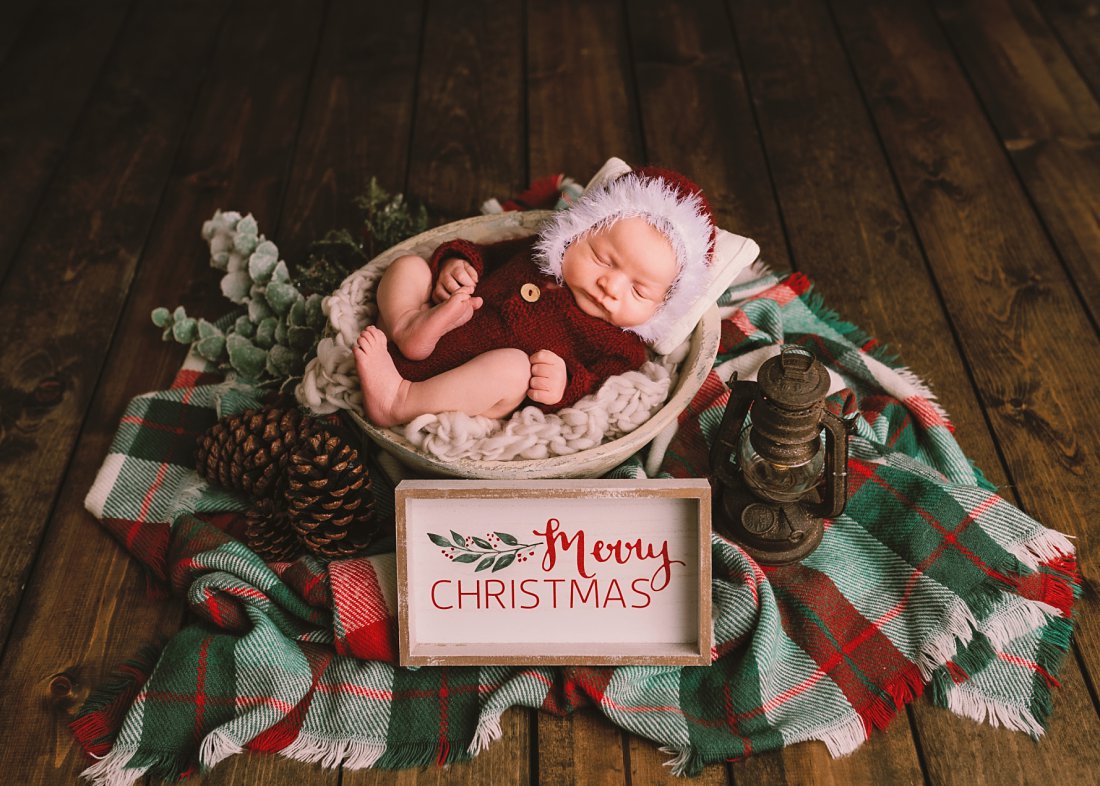 Baby in santa outfit with merry christmas sign | Christmas newborn photos