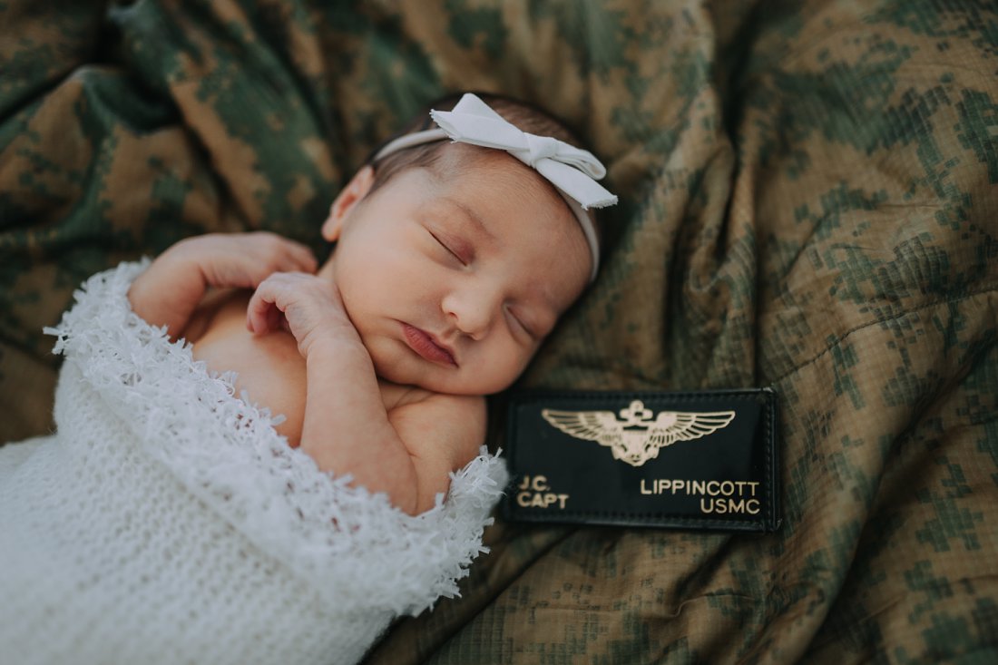baby girl on camo blanket with Marine Pilot nameplate | Dayton Newborn Photographer