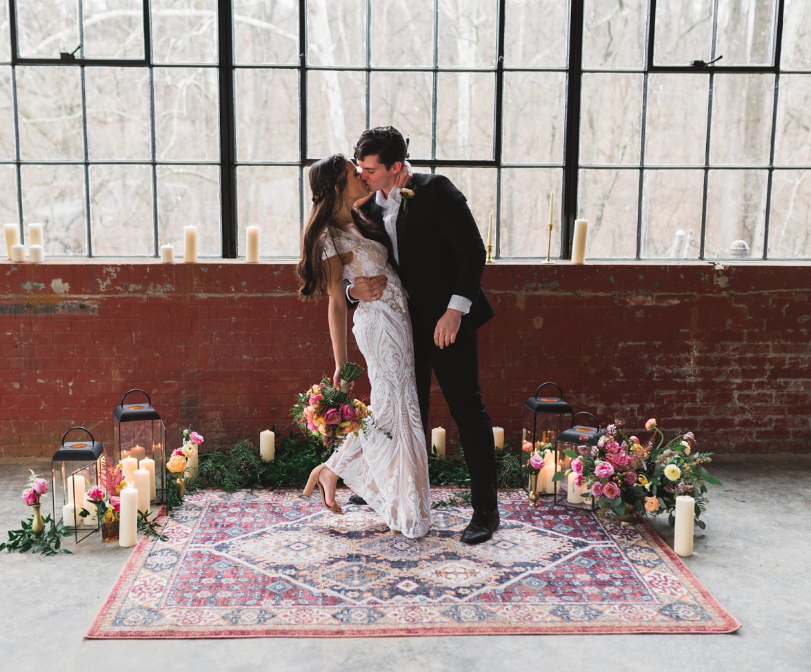 bride and groom kissing | The Wool Factory