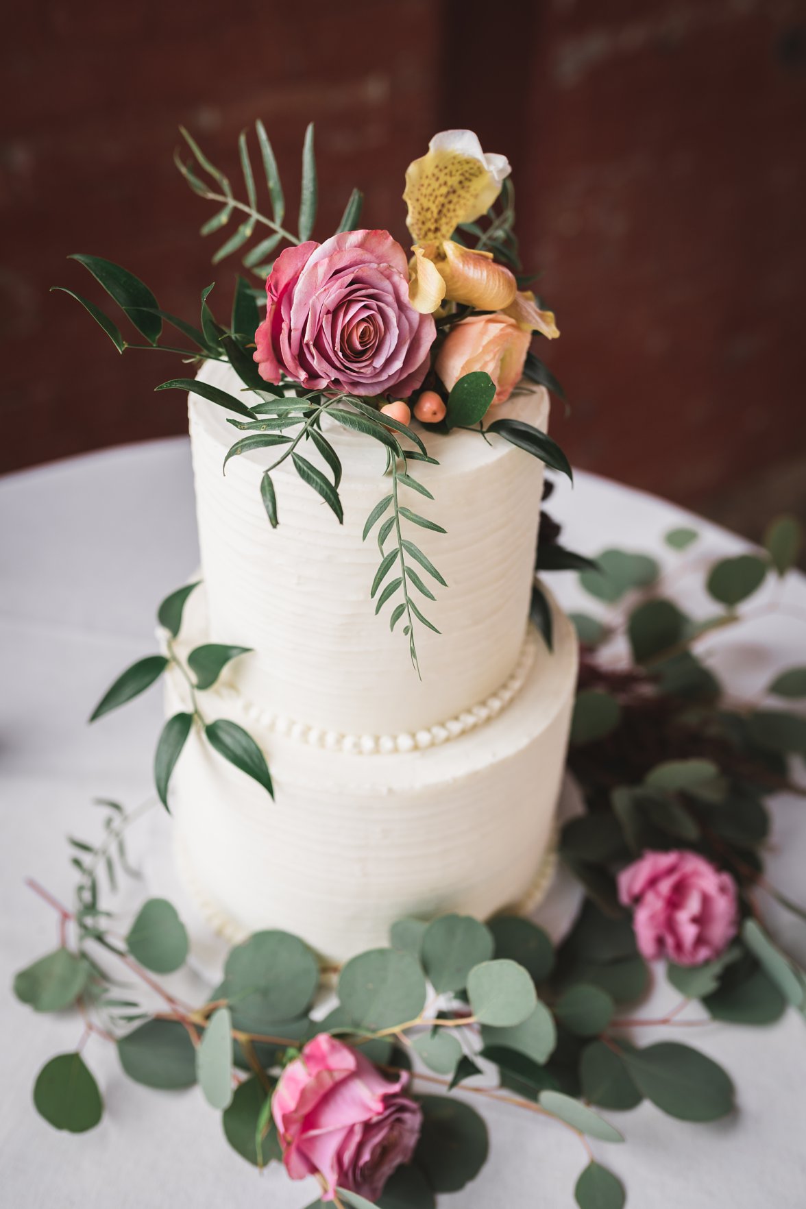 white wedding cake with flowers | Charlottesville Wedding Photographer