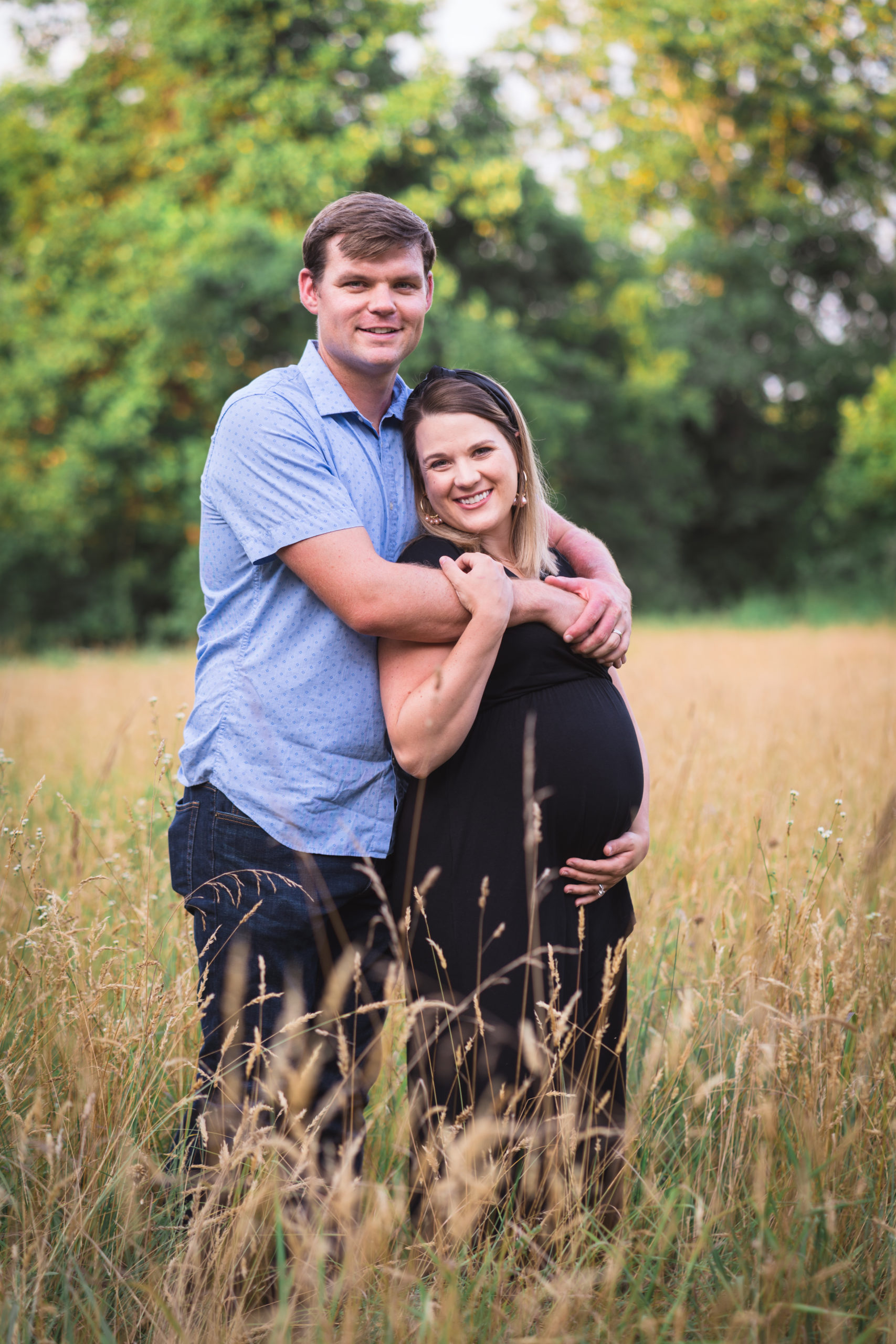 Dad with pregnant mom in field | Charlottesville VA Maternity Photographer