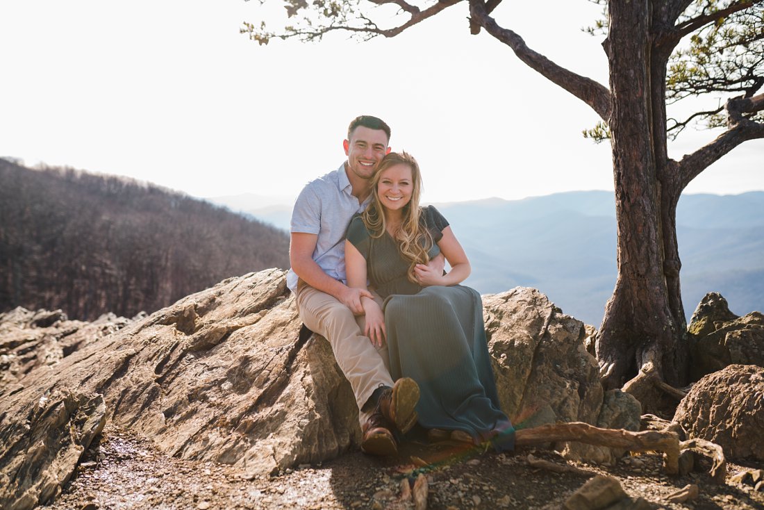 Couple sitting together on rocks | Blue Ridge Parkway Engagement Session