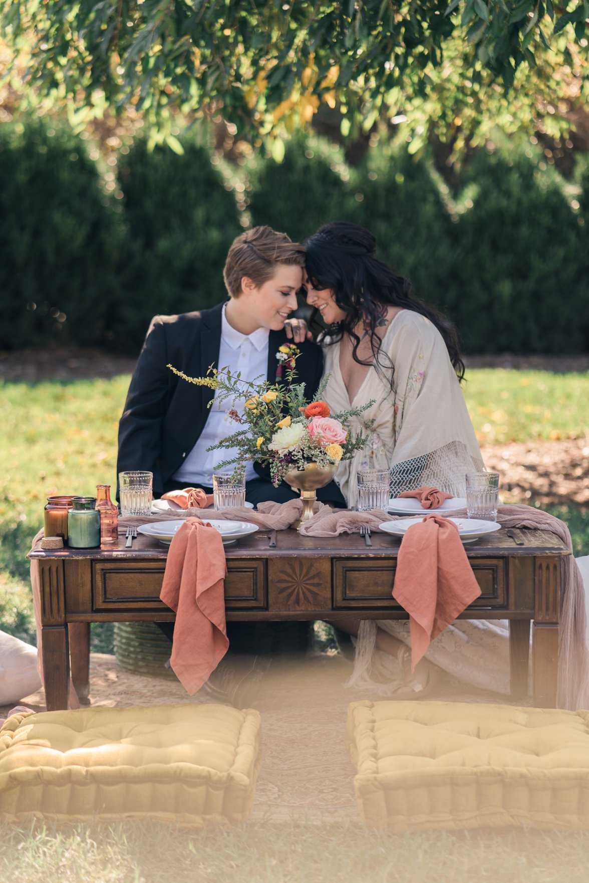 Lesbian couple setting together at table | Market at Grelen Wedding