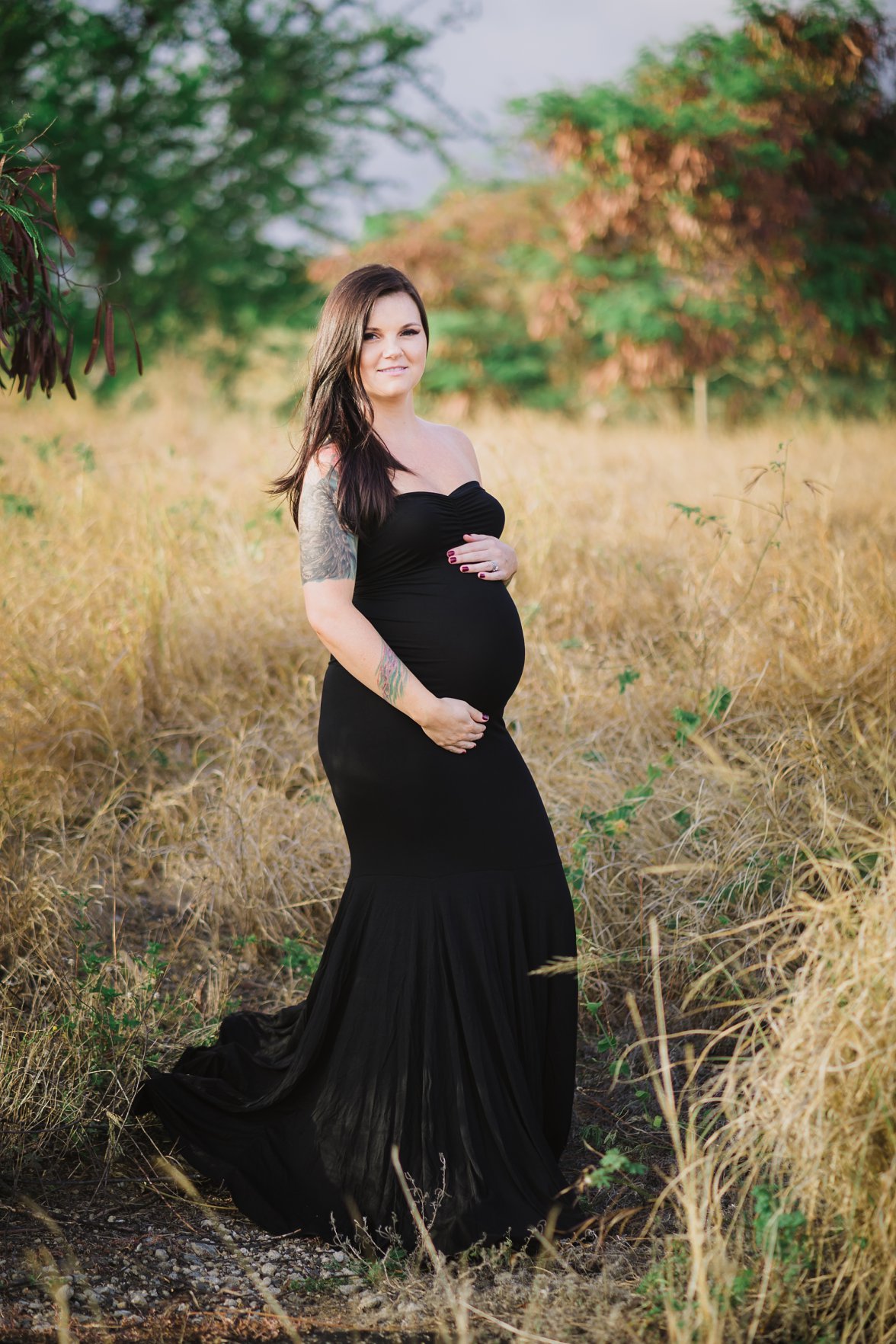 pregnant mom in black dress in field | Charlotteville Maternity Photography
