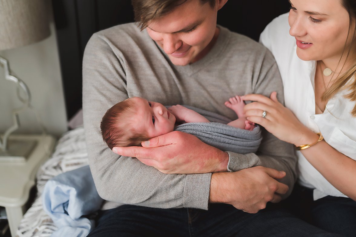 parents holding newborn baby | Newborn Lifestyle Photography