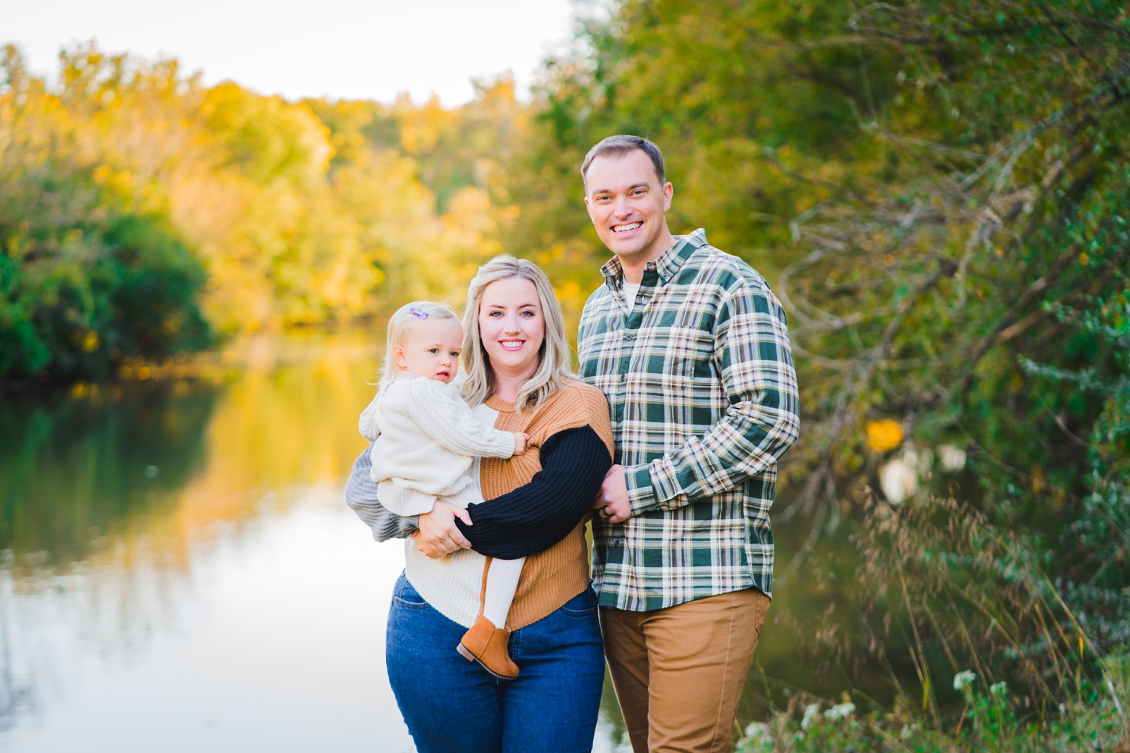 family of three in the fall by a lake | Family Photographers in Montgomery Alabama | Melissa Sheridan Photography