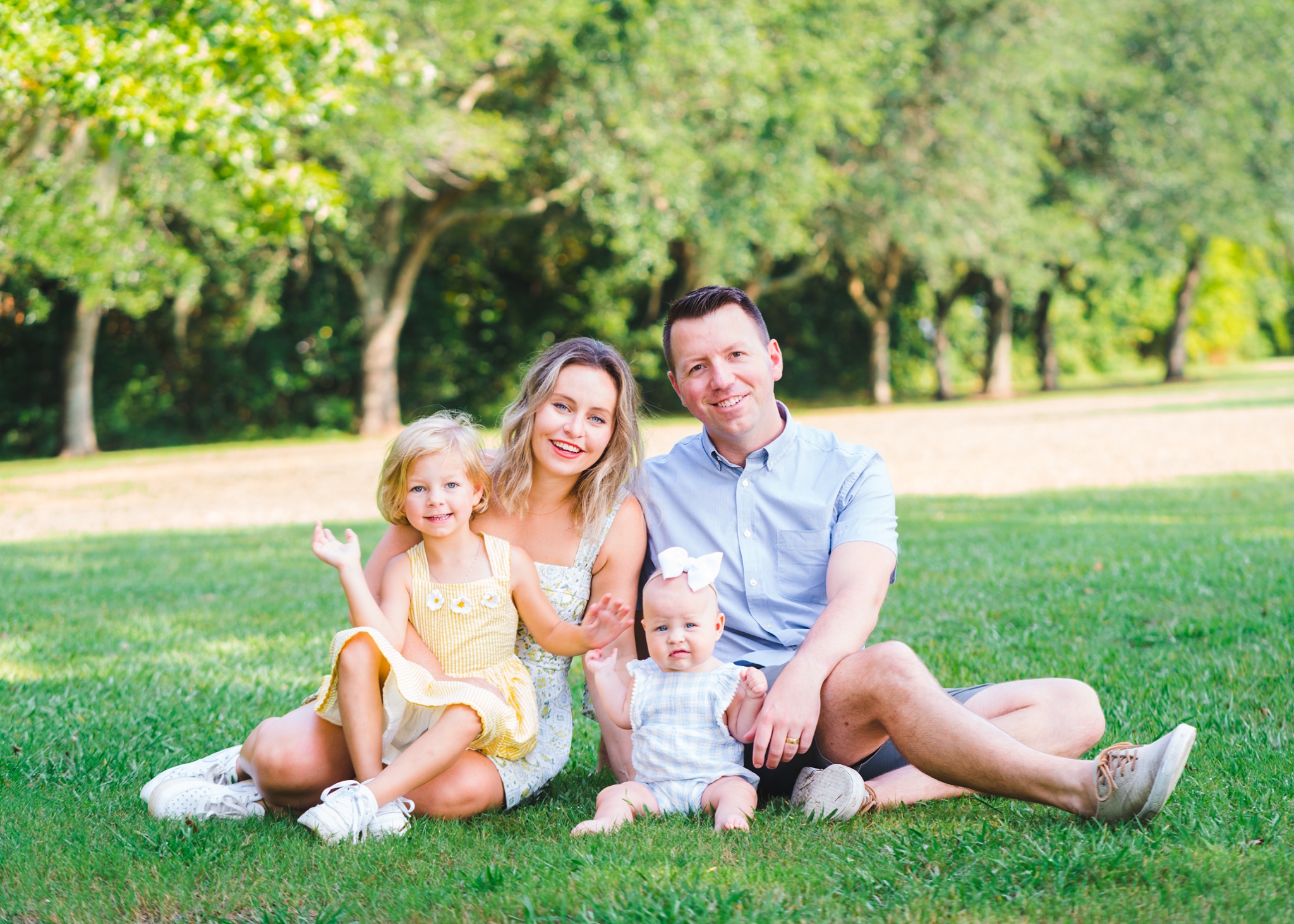 family of four sitting in grass | summer photo session at Blount Cultural Park | Family Photographers in Montgomery Alabama | Melissa Sheridan Photography