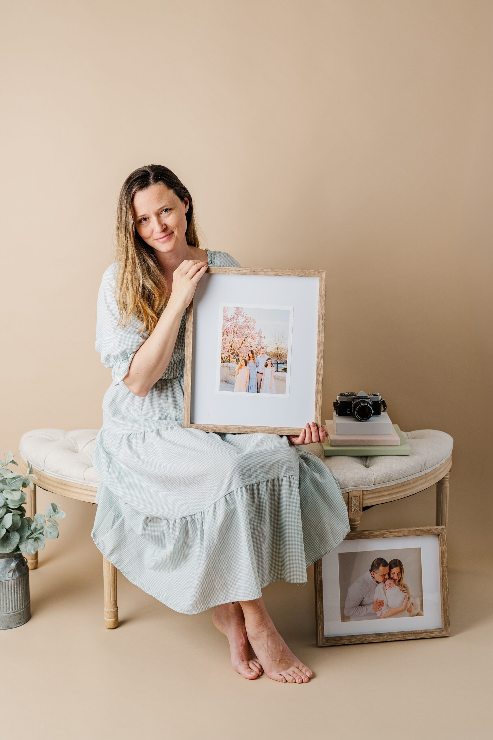 Woman holding framed family photo | Melissa Sheridan Photography
